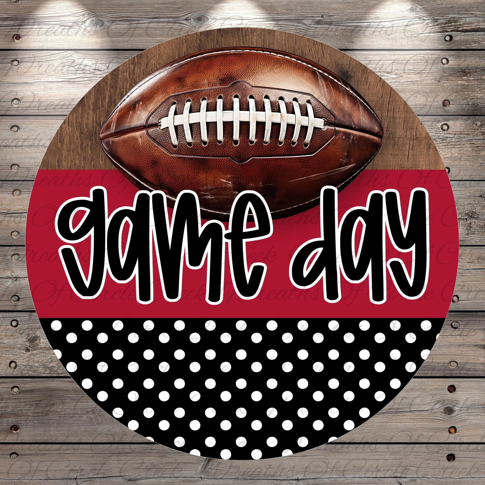 A football is displayed on a wooden surface, with the text "game day" written in a stylized font below it.