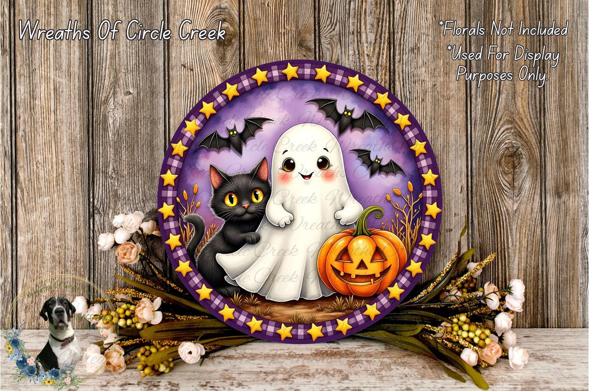 a Halloween-themed wreath with a ghost, a cat, and a pumpkin, all set against a purple and yellow background with stars. The wreath is surrounded by flowers and placed on a wooden surface.