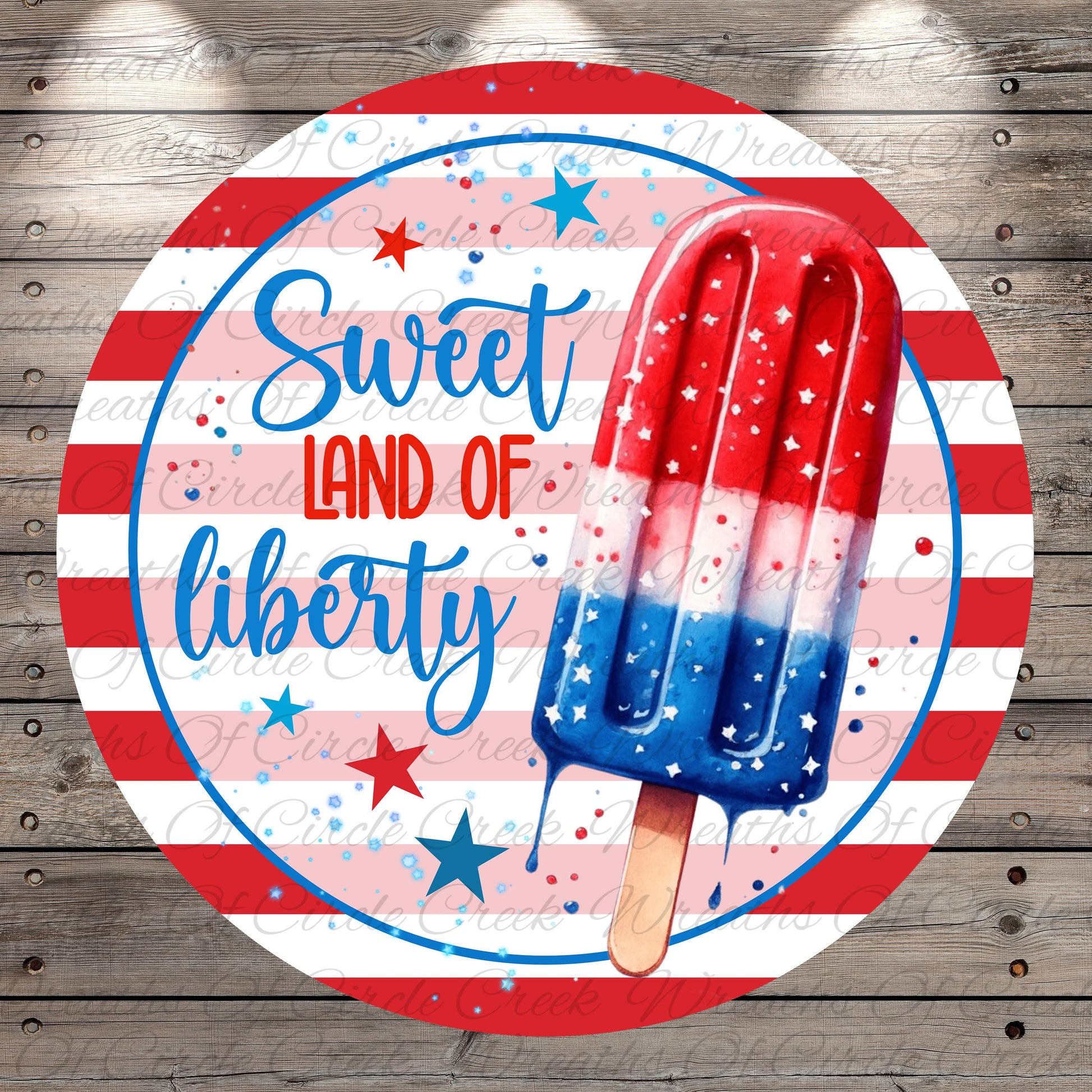 a red, white, and blue popsicle with the text "Sweet Land of Liberty" written around it, set against a background of red and white stripes and stars.