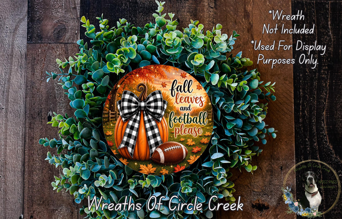 a wreath made of green leaves and a football, with a decorative pumpkin and text that reads "fall leaves and football please".