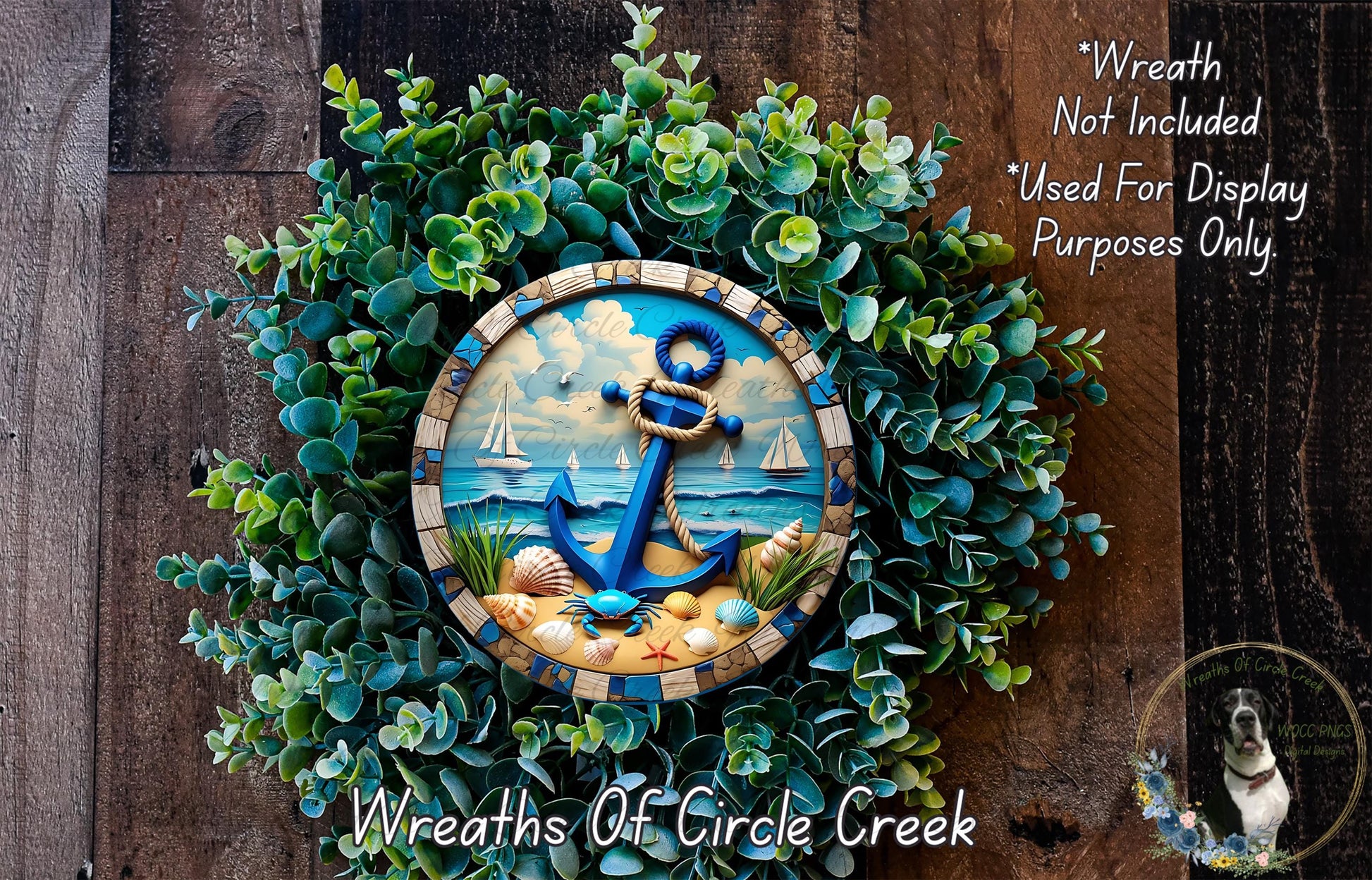 A wreath made of green foliage and featuring a blue anchor and sailboat design, placed on a wooden surface.