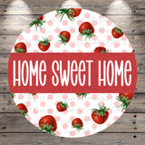 a circular design with a pattern of red strawberries and pink polka dots. The text "HOME SWEET HOME" is prominently displayed in the center of the design.