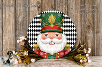 A decorative wreath featuring a nutcracker figure wearing a green hat with a gold leaf, surrounded by a black and white checkered background and a floral arrangement.
