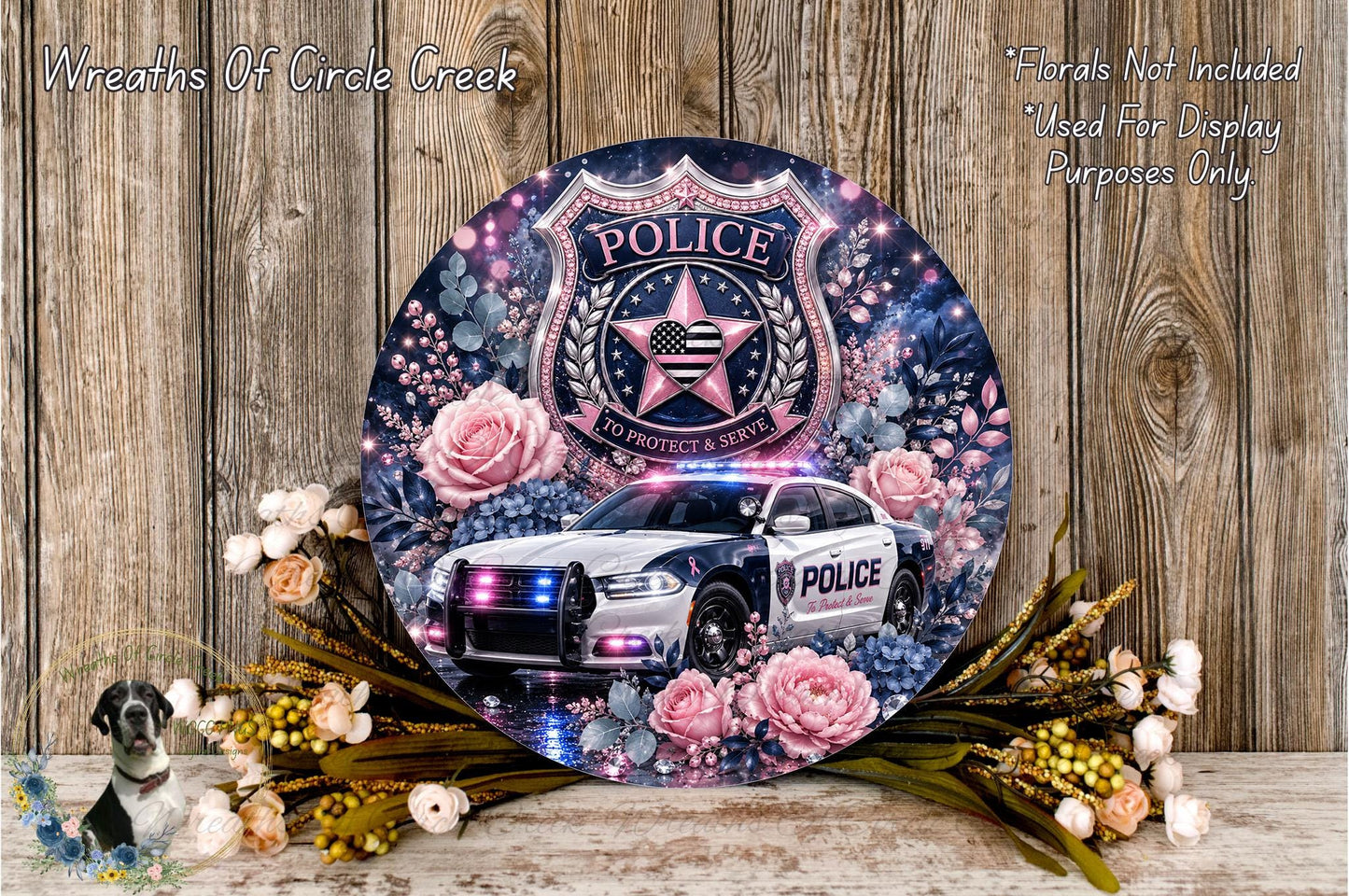 A decorative police car with a floral design, surrounded by flowers and foliage, and a shield-shaped emblem with the word "POLICE" on it.