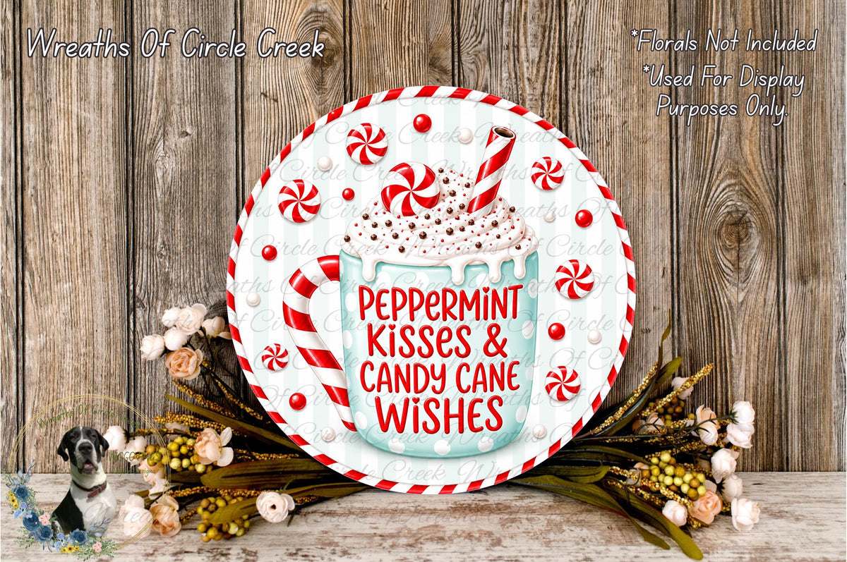 A decorative plate with a peppermint-themed design, surrounded by candy canes and flowers, placed on a wooden surface.
