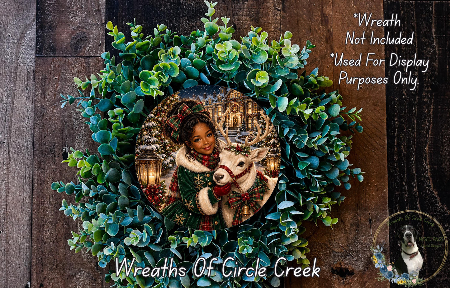 A wreath made of green leaves and a white reindeer, with a woman in a green coat and a red scarf standing in the center.