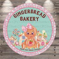 a gingerbread bakery sign on a wooden wall