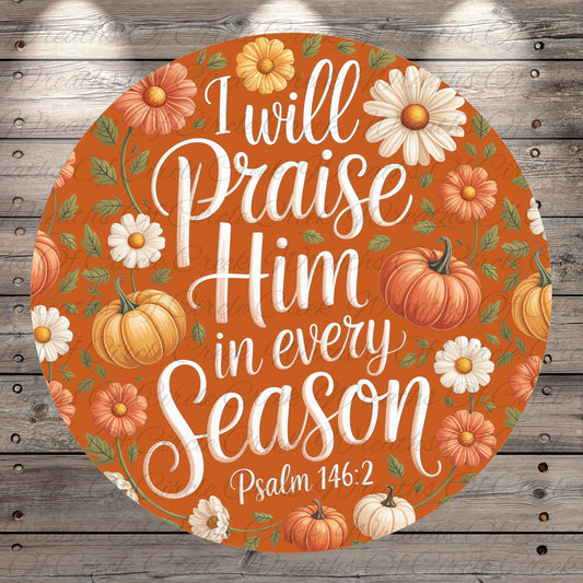 The image is a circular graphic with a vibrant orange background, featuring a variety of autumn-themed elements such as pumpkins, flowers, and leaves. The text "I will praise Him in every season" is prominently displayed in the center of the image, surrounded by the seasonal motifs.
