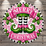 A festive Christmas-themed design featuring a pair of green elf boots with white stripes, a pink banner with the text "MERRY CHRISTMAS", and various decorative elements such as holly leaves and berries.
