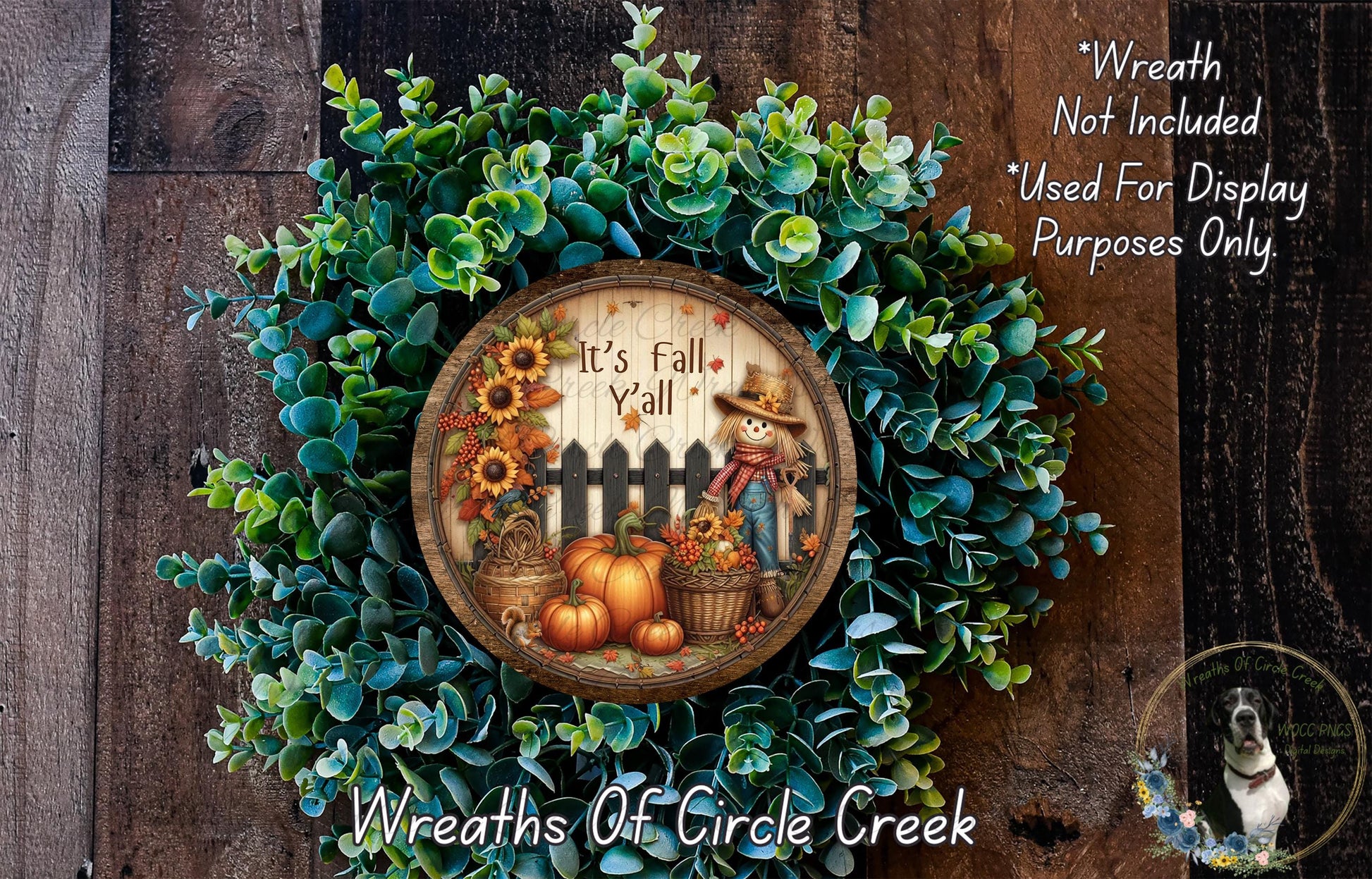 a wreath with a picture of a scarecrow and pumpkins