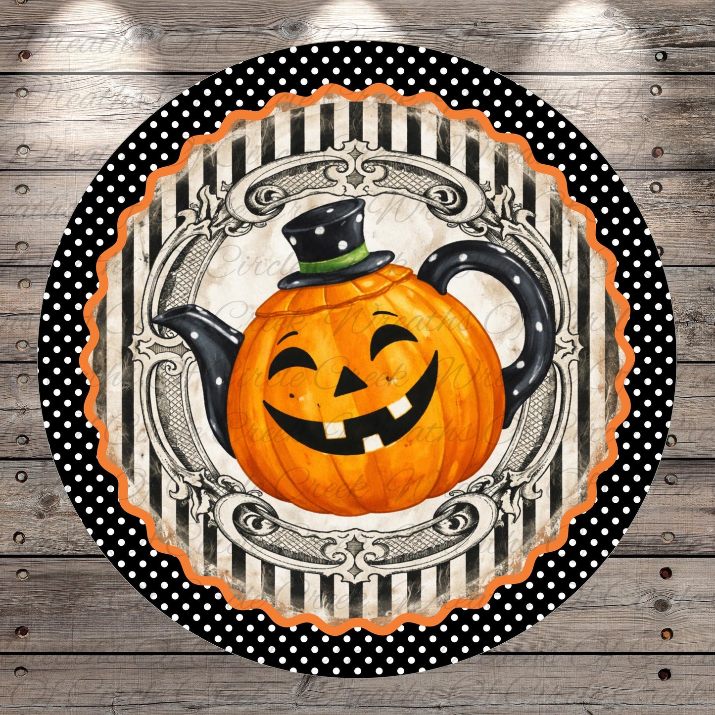 A Halloween-themed teapot with a smiling pumpkin face is displayed on a round, decorative plate with a black and white polka dot border.