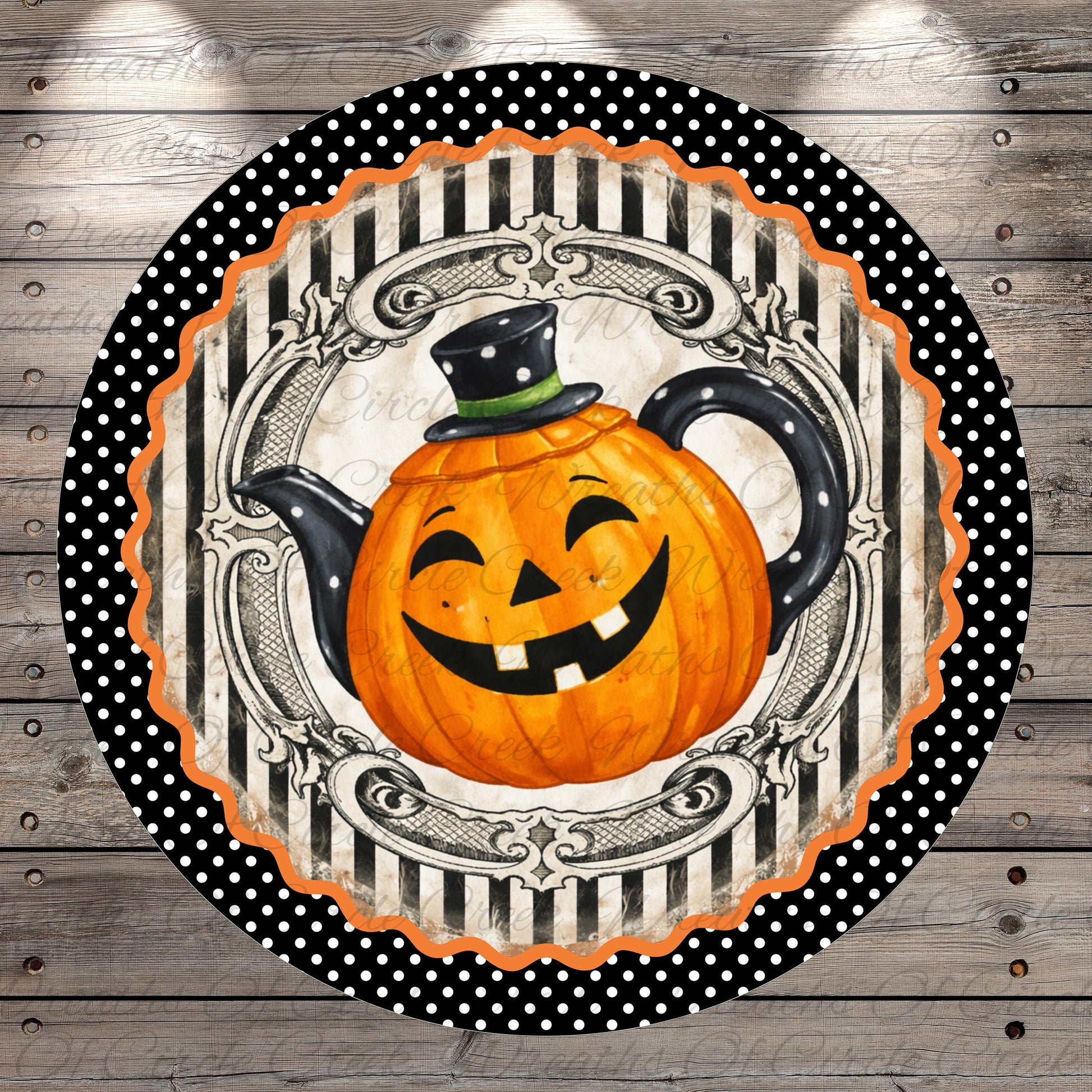 A Halloween-themed teapot with a smiling pumpkin face is displayed on a round, decorative plate with a black and white polka dot border.