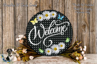 a sign that says welcome with daisies on it