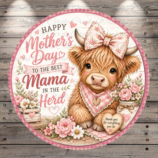 A round, decorative sign with a mother cow wearing a bow and surrounded by flowers, with the text "Happy Mother's Day to the best Mama in the herd" and a heart-shaped sign that says "Thank you for everything you do".