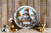 A decorative plate featuring a small bird wearing a scarf and hat, surrounded by autumn foliage and pine cones, with the text "Sweater Weather" displayed on it.