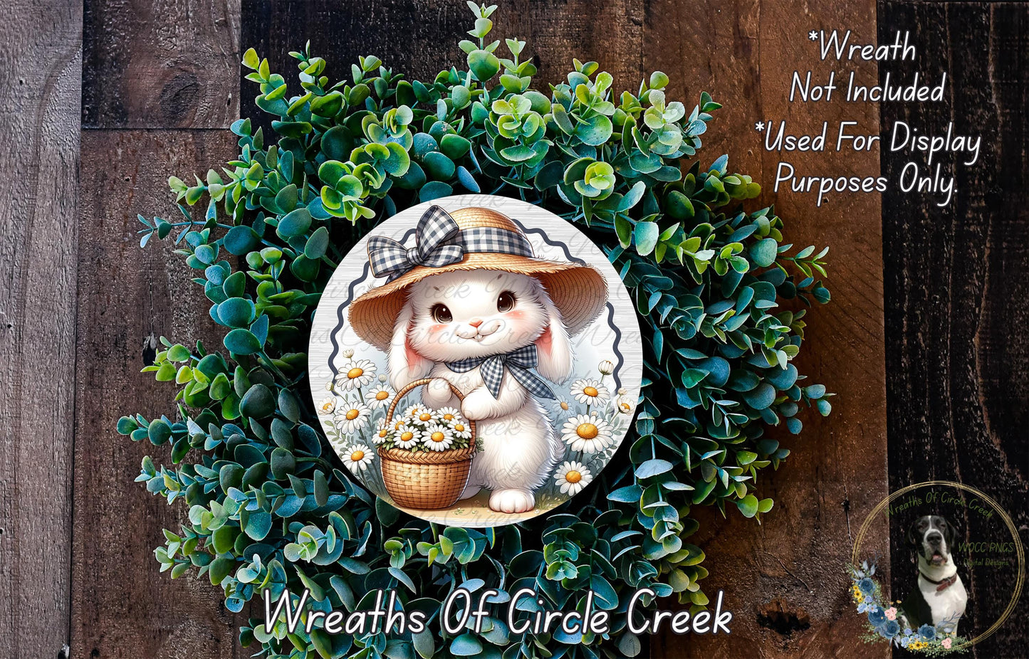 A wreath featuring a cartoon rabbit wearing a hat and holding a basket of flowers, surrounded by a lush green plant.