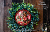A wreath made of green leaves and red and white striped ribbons, with a dog wearing a red bandana in the center.
