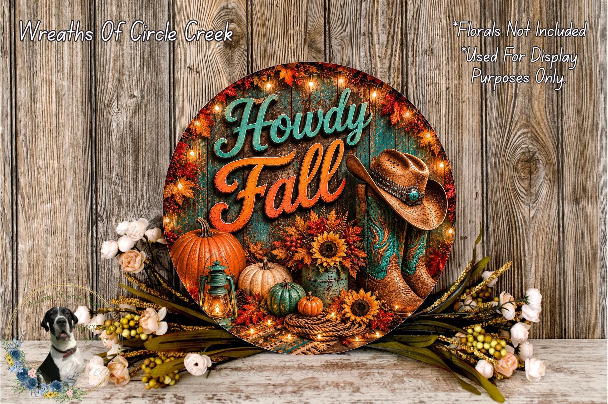 A decorative sign for "Howdy Fall" featuring a cowboy hat, pumpkins, sunflowers, and other fall-themed items, surrounded by a floral arrangement and lit candles.