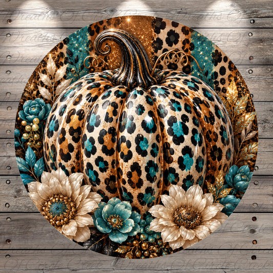 A large leopard print pumpkin with a golden stem and leaves, surrounded by white and blue flowers, against a wooden background.