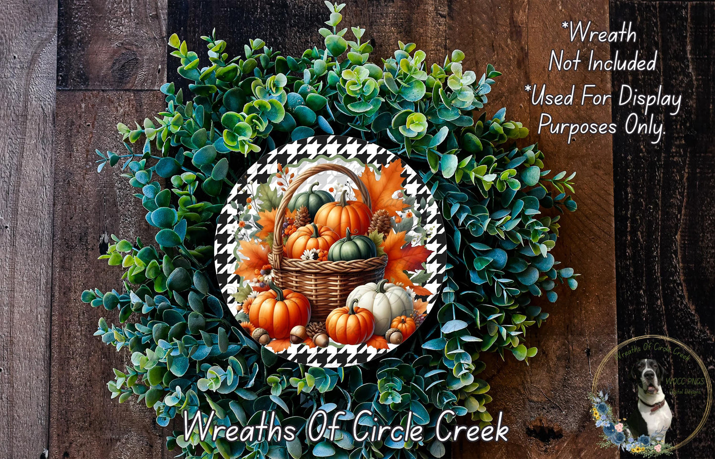 The image is a wreath made of various fall-themed elements, including pumpkins, gourds, and greenery, displayed on a wooden surface.