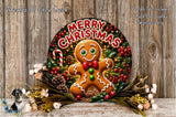 A festive Christmas wreath featuring a gingerbread man surrounded by holiday decorations, including pine cones, berries, and flowers. The wreath is displayed on a wooden surface, and the text "Merry Christmas" is prominently displayed on the wreath.