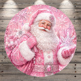A festive Christmas scene featuring a smiling, bearded Santa Claus figure dressed in a pink outfit, surrounded by snowflakes and sparkling decorations.