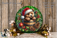 A round wreath with a bear wearing a Santa hat, surrounded by pine cones, berries, and other holiday decorations, placed on a wooden surface.