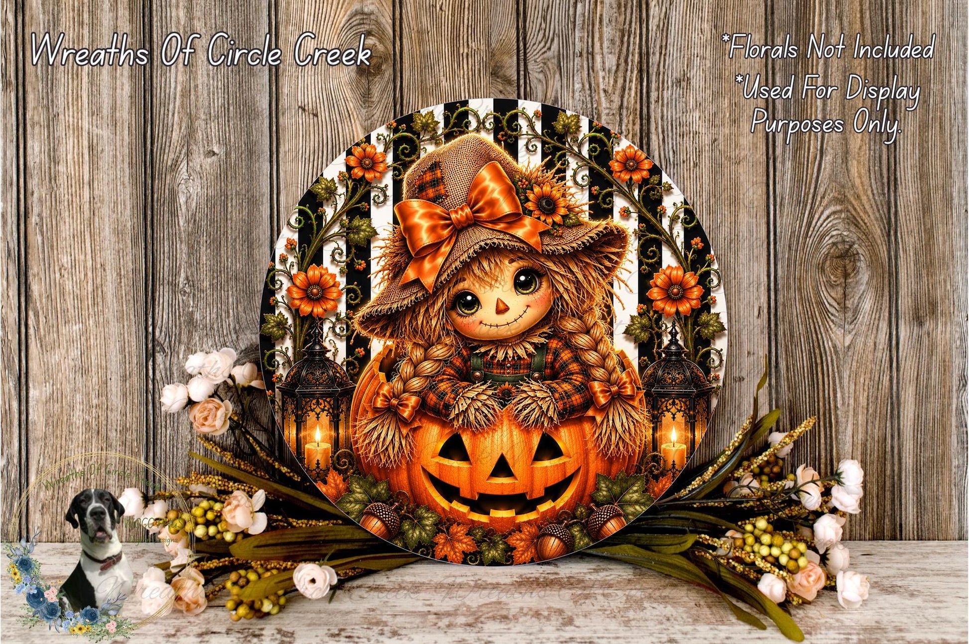 a Halloween-themed wreath with a pumpkin and a scarecrow, surrounded by flowers and greenery.