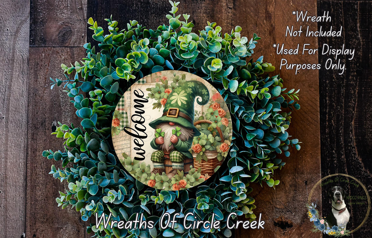 a wreath with a gnome and greenery, and a sign that reads "Welcome" in the center. The sign is surrounded by a lush, colorful wreath.
