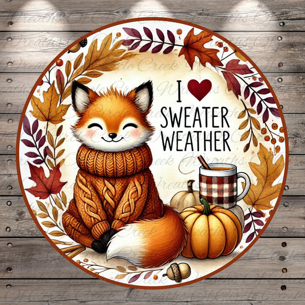 A cheerful illustration of a fox wearing a cozy sweater and surrounded by autumn elements, including a pumpkin, leaves, and a mug of hot beverage, with the text "I ❤️ sweater weather" displayed.