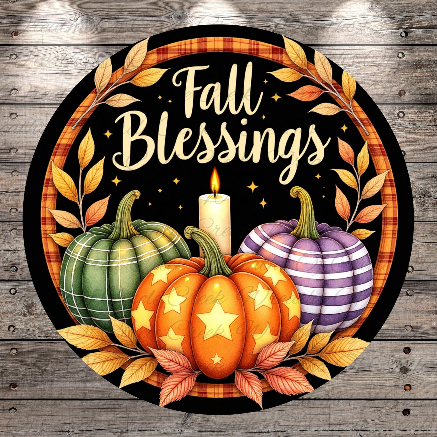 a circular design with a wreath of leaves surrounding three pumpkins, one of which has a lit candle in it. The text "Fall Blessings" is written above the pumpkins.