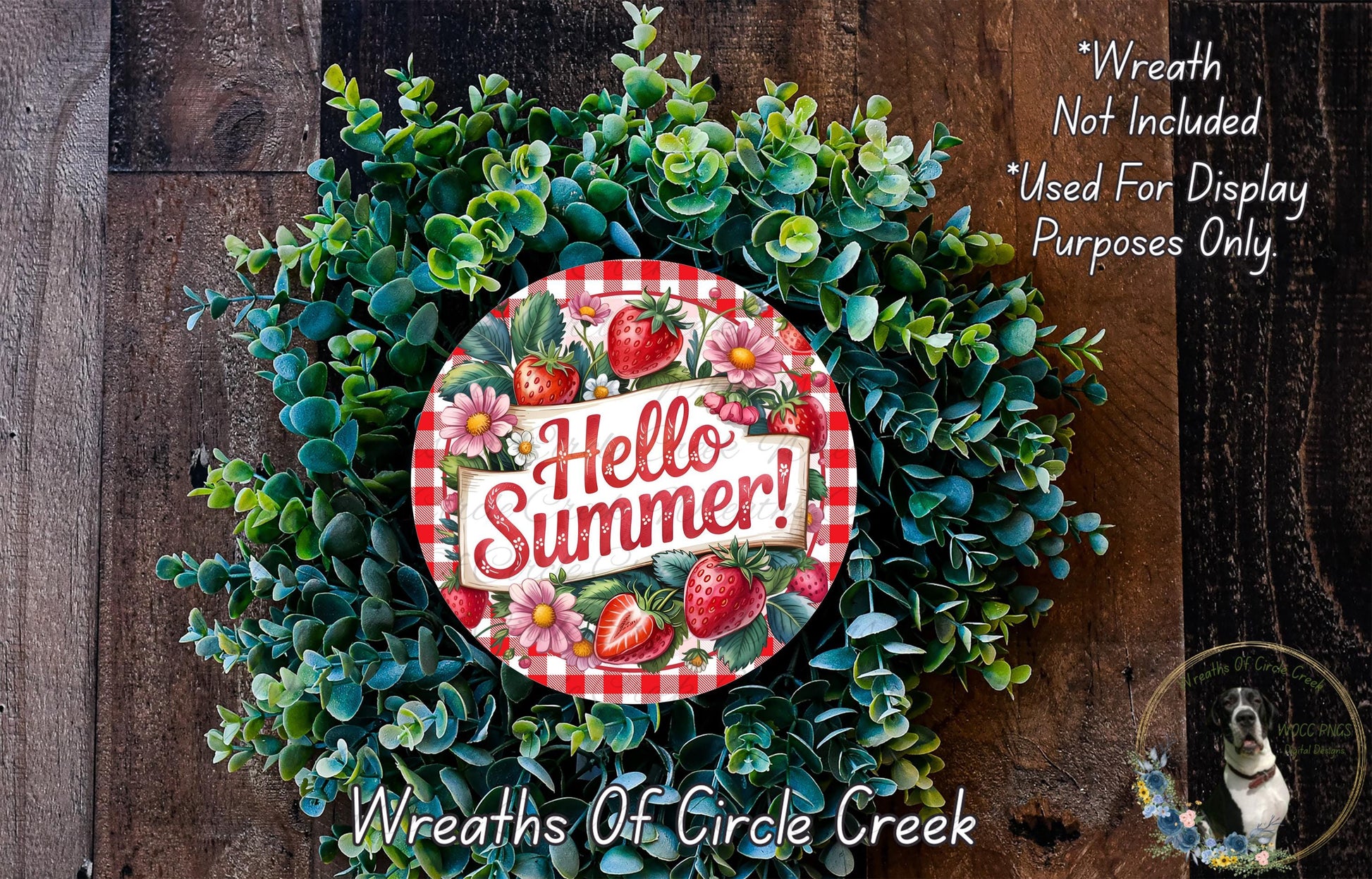 A wreath made of green foliage and flowers, with a red and white sign that says "Hello Summer!" in the center.