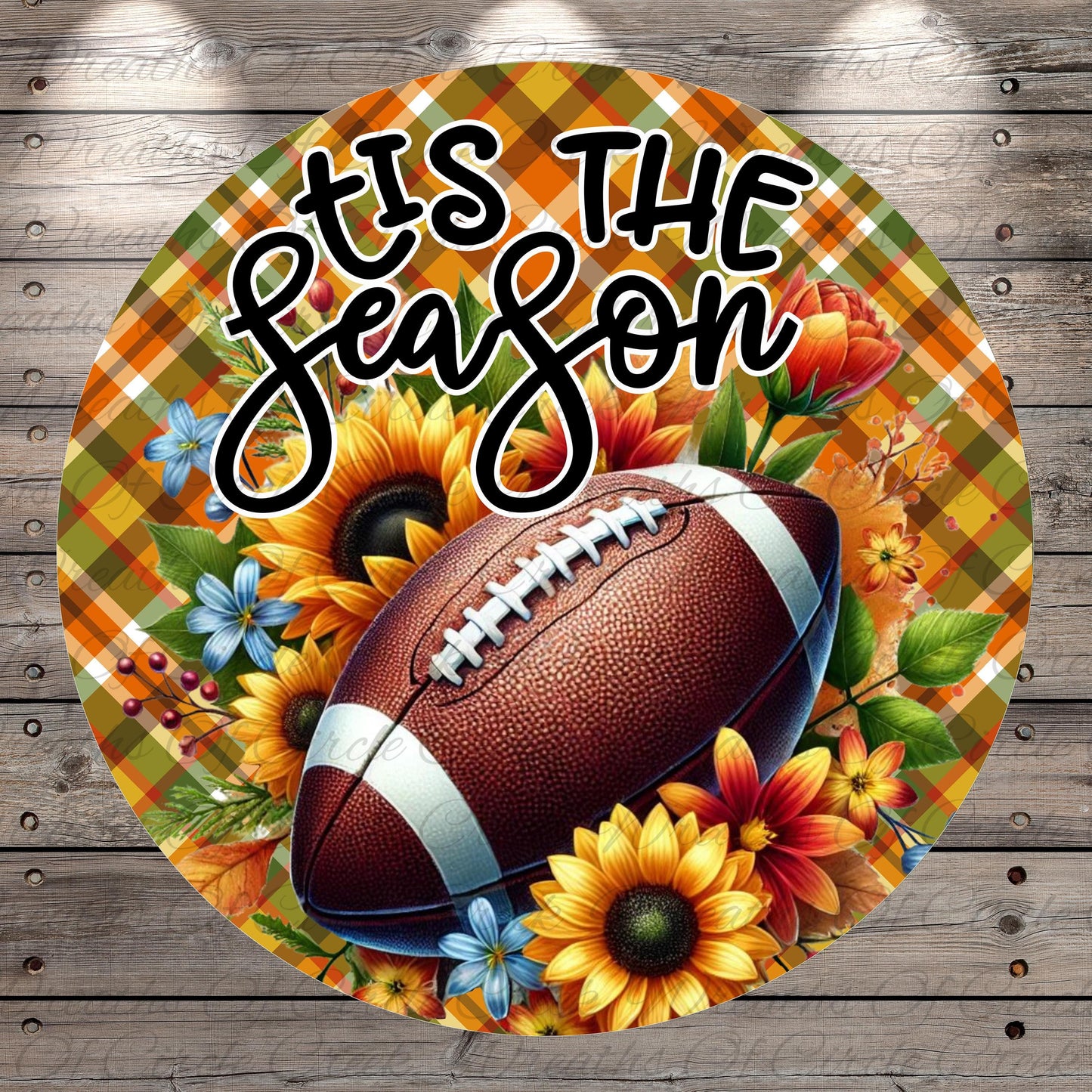 A football surrounded by sunflowers and autumn foliage, with the text "TIS THE SEASON" written above it.