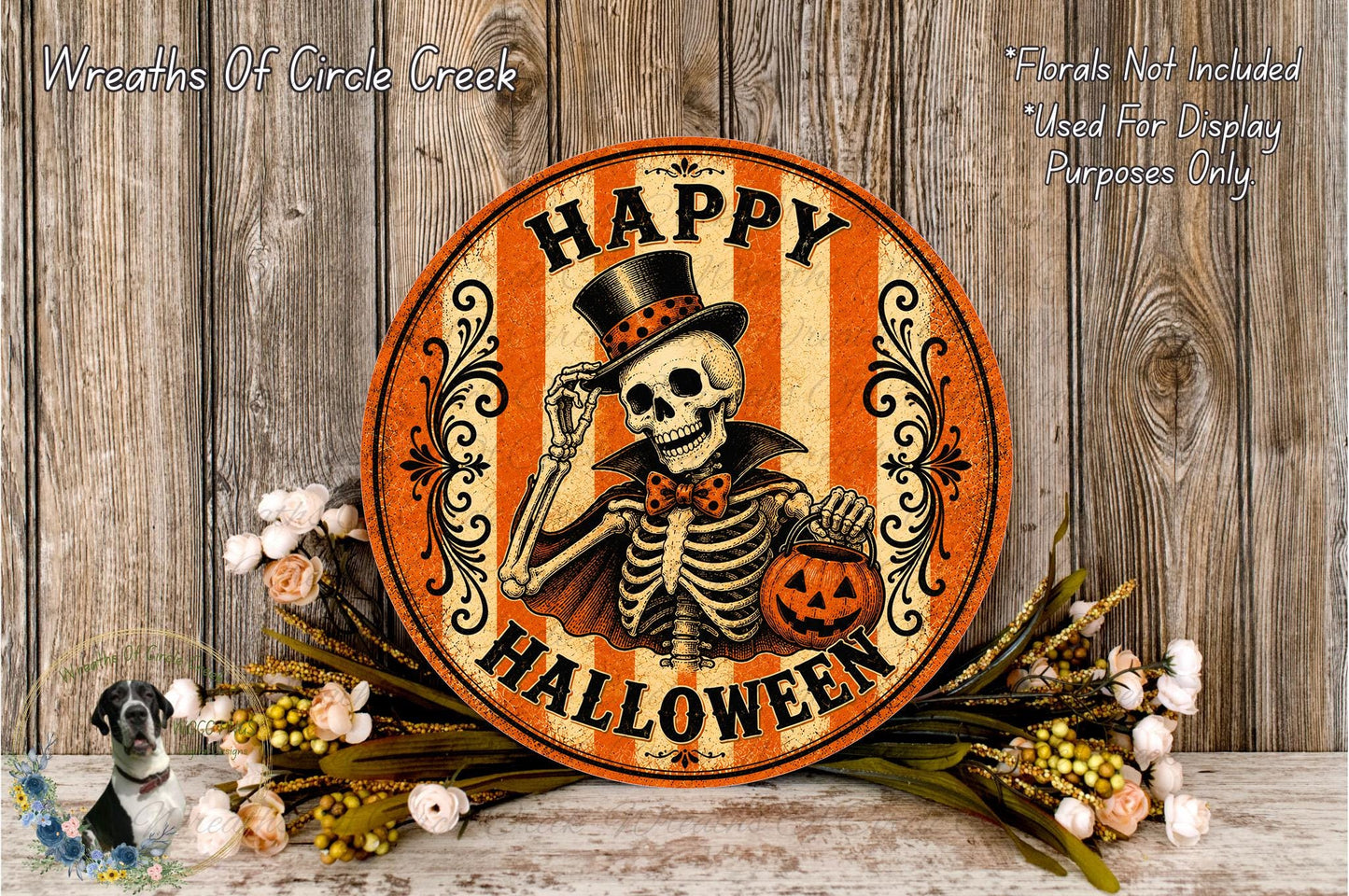 A Halloween-themed sign featuring a skeleton wearing a top hat and holding a jack-o-lantern, surrounded by a wreath of flowers and a wooden background.