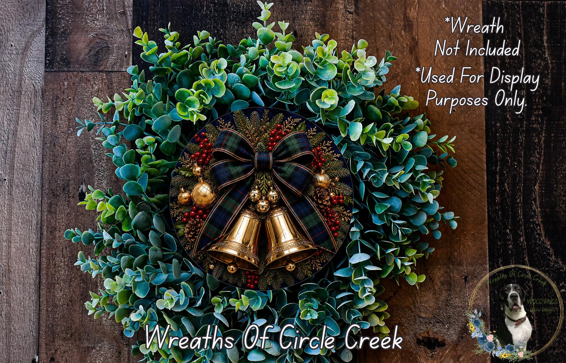 A wreath made of green leaves, red berries, and gold bells, with a plaid bow and a dog in the background.