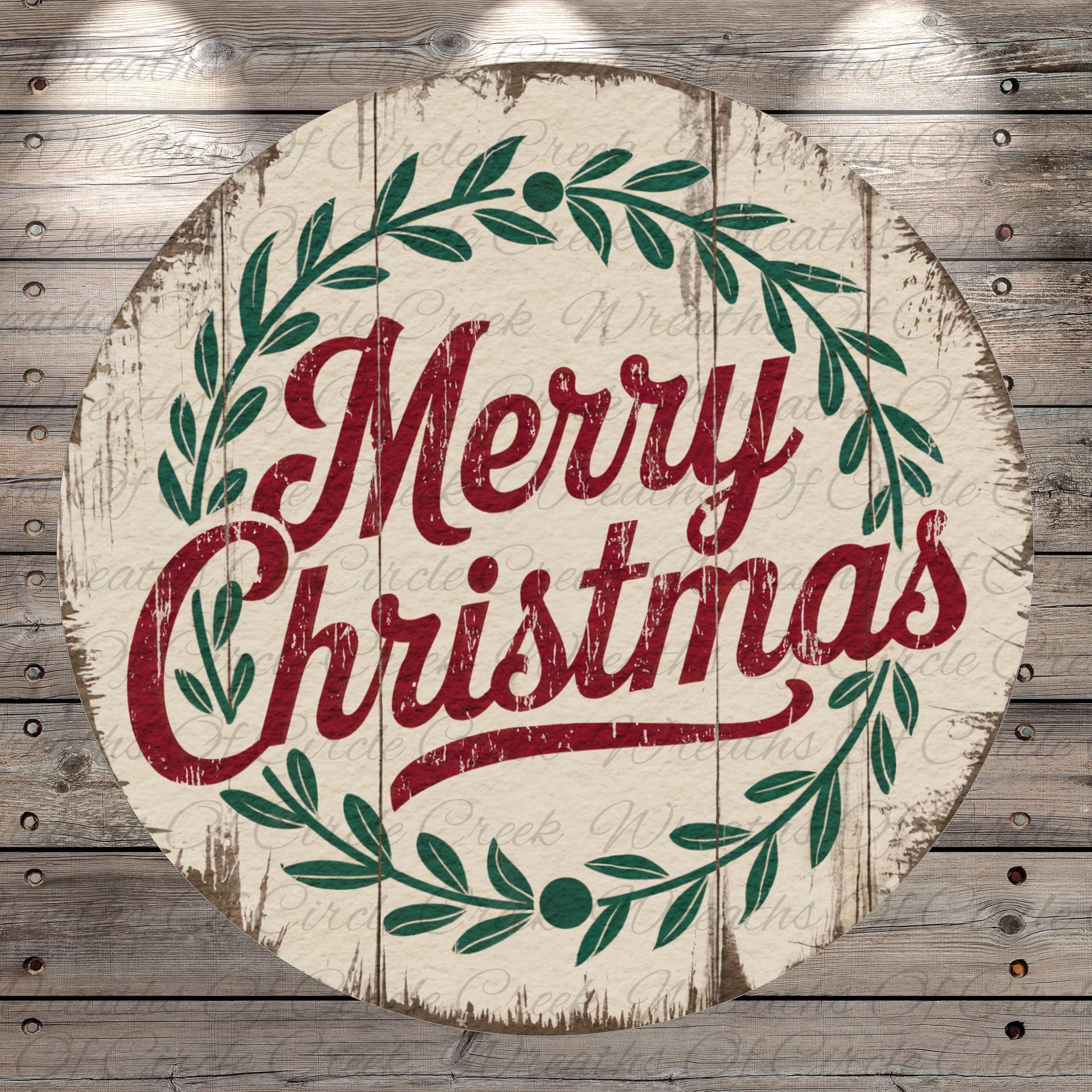 A circular wooden sign with the text "Merry Christmas" in a decorative font, surrounded by a wreath of green leaves.