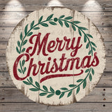 A circular wooden sign with the text &quot;Merry Christmas&quot; in a decorative font, surrounded by a wreath of green leaves.