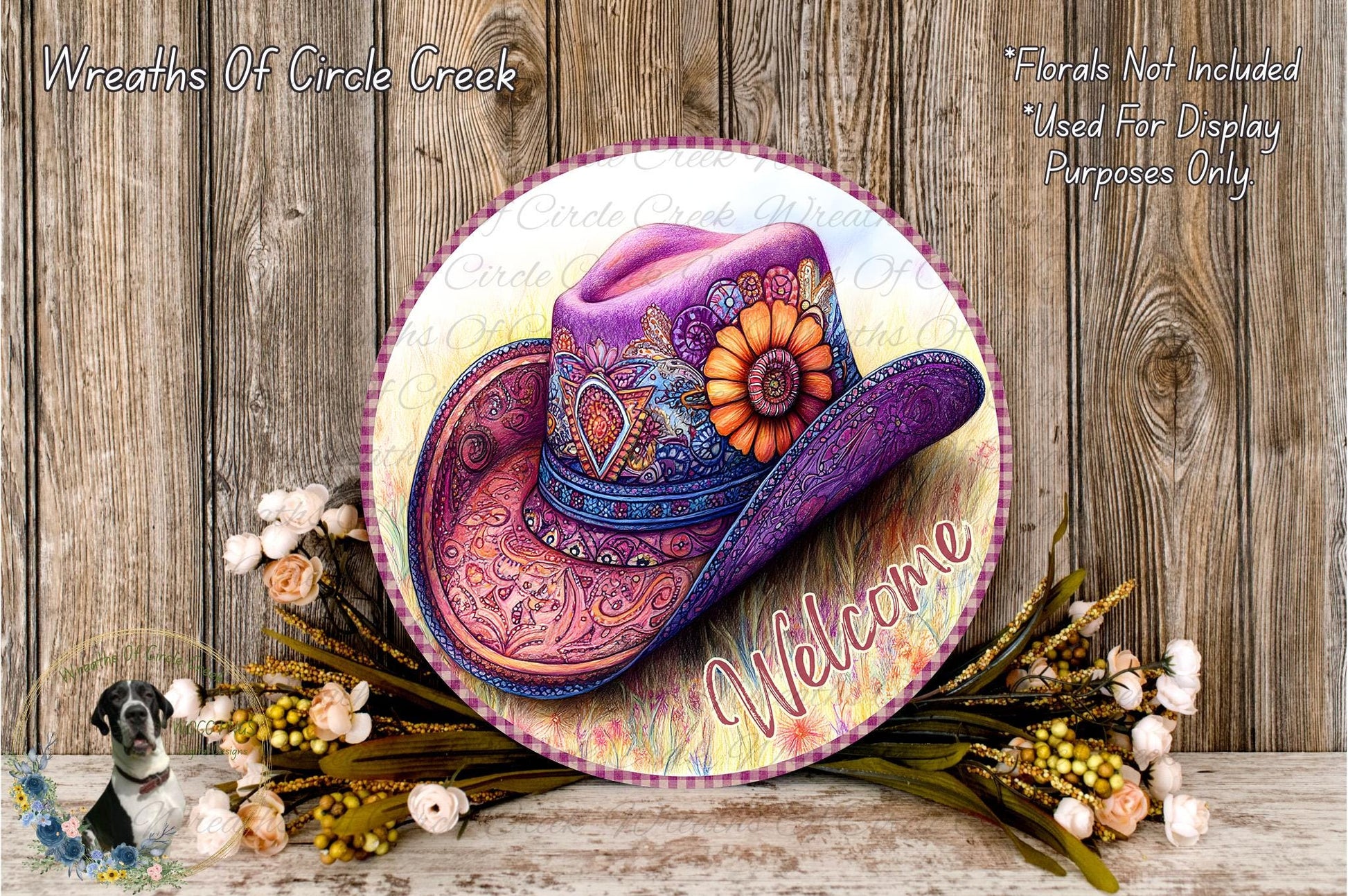 a decorative cowboy hat with a colorful floral design, surrounded by a wreath of flowers and greenery, and a welcoming message.