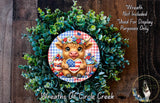 a wreath with a cow wearing a patriotic outfit, including a red, white, and blue checkerboard pattern, and holding a heart-shaped American flag. The wreath is surrounded by a lush green plant, and there is a small dog in the bottom right corner of the image.