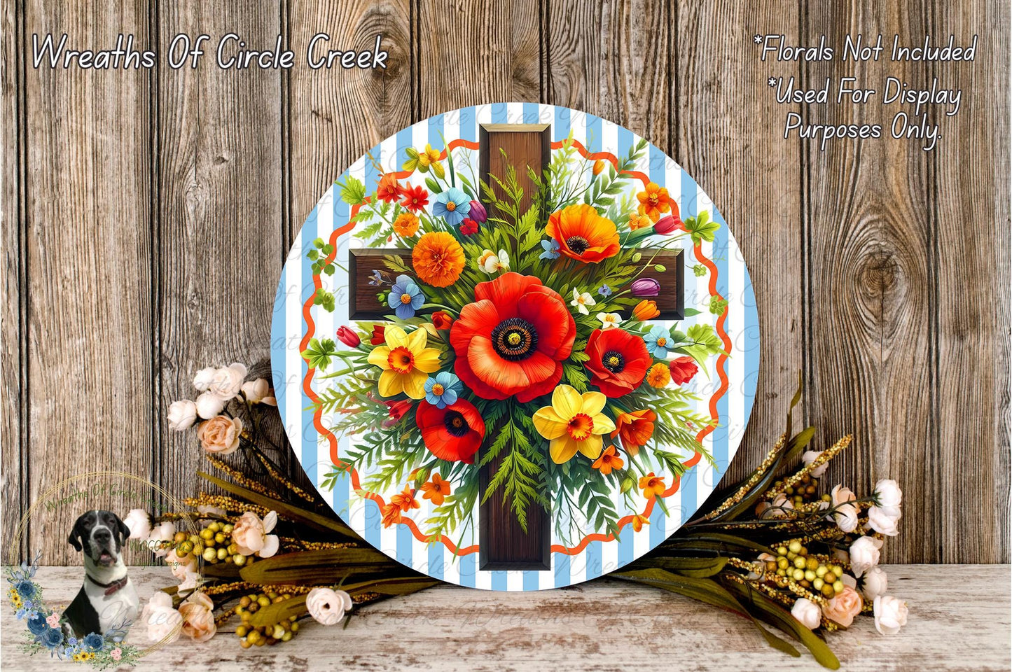 a round wooden plaque with a cross design, surrounded by a vibrant arrangement of flowers and greenery.
