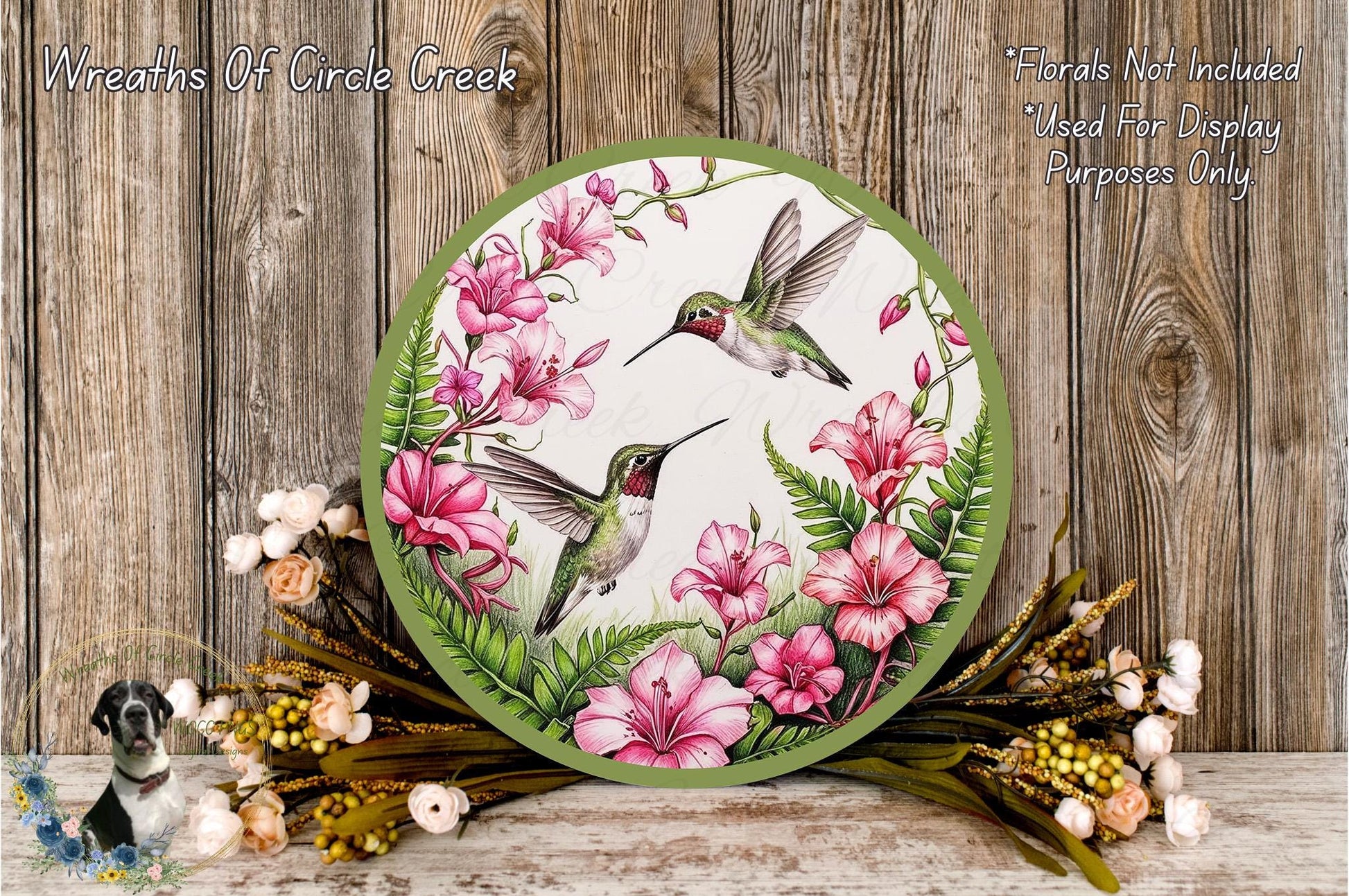 a picture of a hummingbird with pink flowers on it