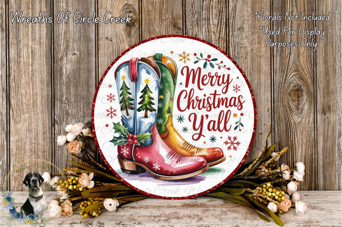 A festive Christmas wreath with a pair of red cowboy boots as the central design element, surrounded by flowers and greenery.