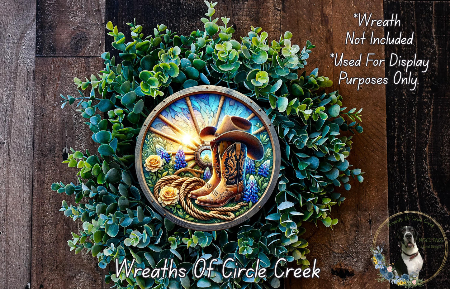 A wreath made of green foliage and featuring a cowboy hat and boots, with a sunburst design.