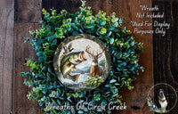 A wreath made of green foliage and featuring a deer and a fish, with a text overlay that reads "Wreath Not Included * Used For Display Purposes Only" and "Wreaths Of Circle Creek".
