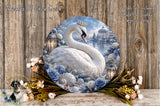 A large circular decorative plate featuring a white swan surrounded by a floral arrangement and a serene landscape.