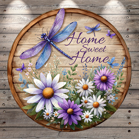 A wooden sign with a dragonfly and flowers, along with the text "Home Sweet Home" written on it.