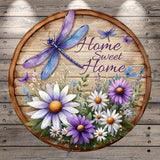 A wooden sign with a dragonfly and flowers, along with the text "Home Sweet Home" written on it.