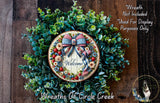 a wreath with a welcome sign on it