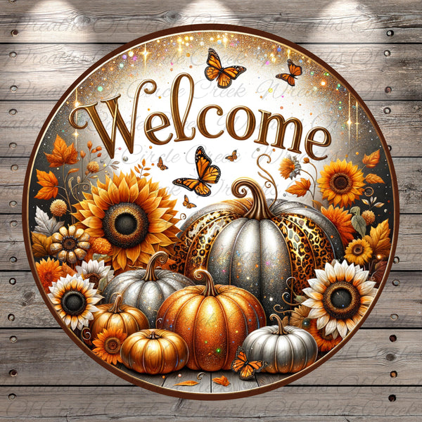 a circular sign with a welcoming message surrounded by autumn-themed elements such as sunflowers, pumpkins, and butterflies.