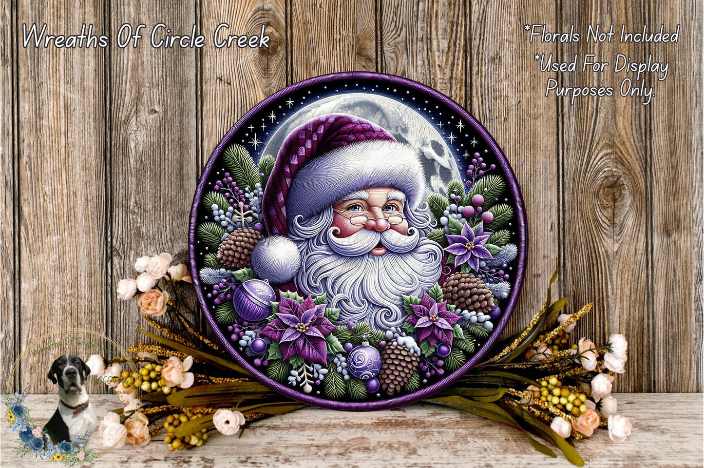 A decorative wreath featuring a Santa Claus face surrounded by various holiday-themed elements, including flowers, pine cones, and a full moon.